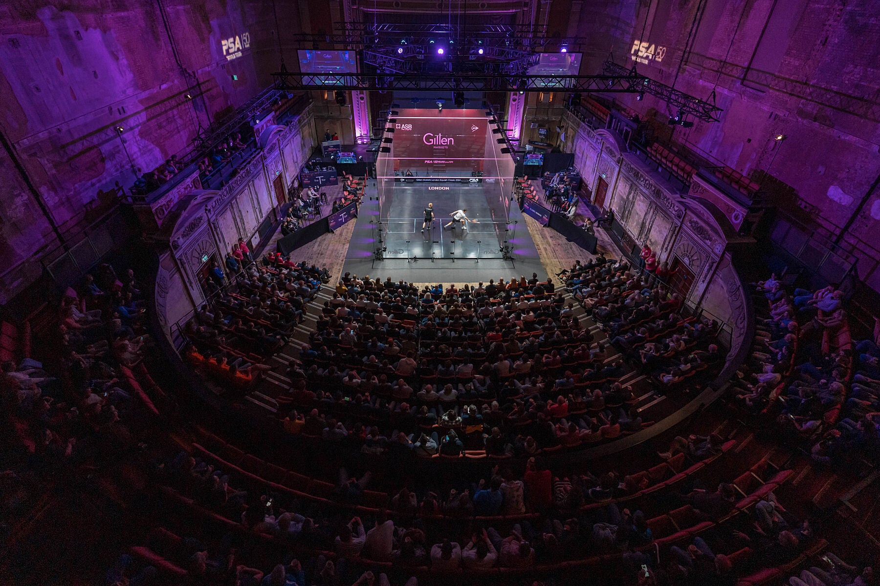 Interior image of the London Classic Squash Venue featuring Paul Coll and Joel Mkain